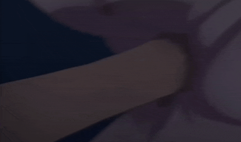 a man in a suit and tie is holding a woman 's butt .