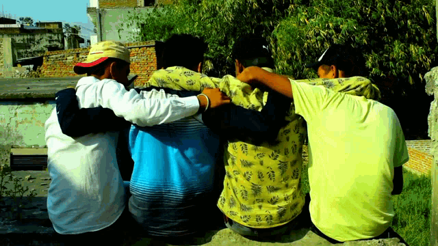 a group of young men hugging each other with one wearing a yellow shirt that says ' hawaiian ' on it