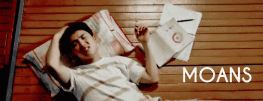 a man laying on a wooden bed with the word moans written on the bottom