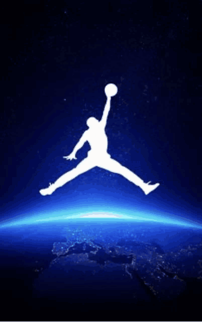 a silhouette of a man holding a basketball in his hand