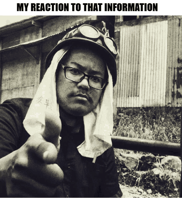 a black and white photo of a man with a towel around his head and the words my reaction to that information