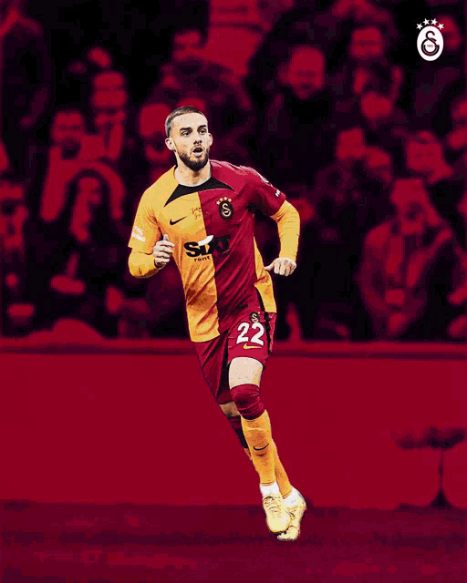 a soccer player with the number 22 on his jersey is running on the field