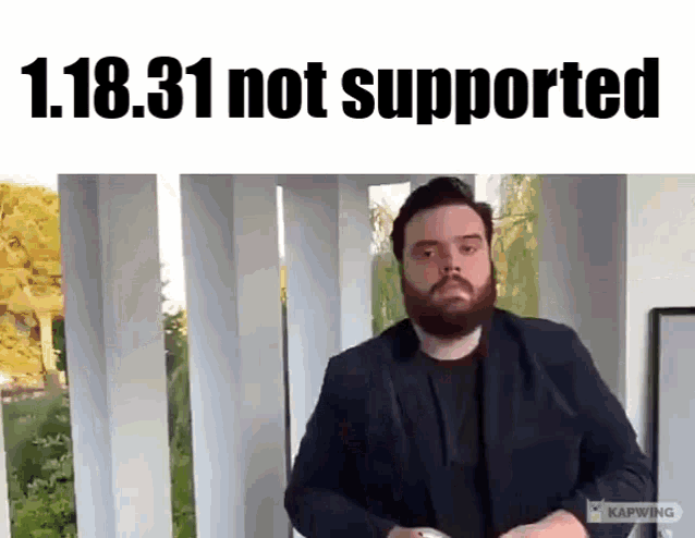 a man with a beard is standing in front of a sign that says 1.18.30 not supported