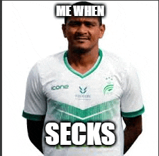 a man wearing a white and green soccer jersey with the words `` me when socks '' on it .
