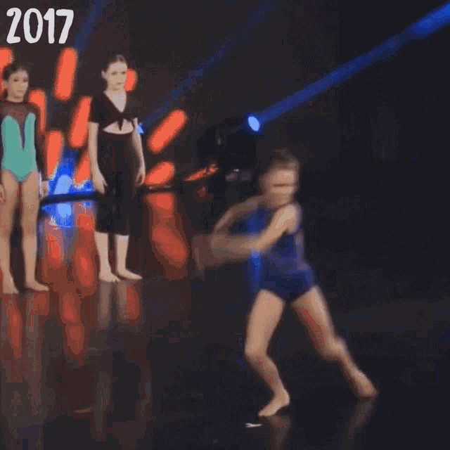 a blurred image of a group of people with the year 2017 on the bottom