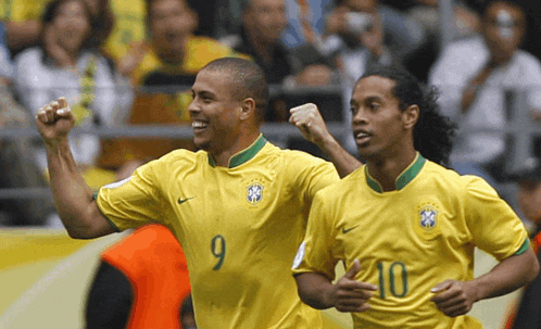 two soccer players wearing yellow jerseys with the number 9 and 10