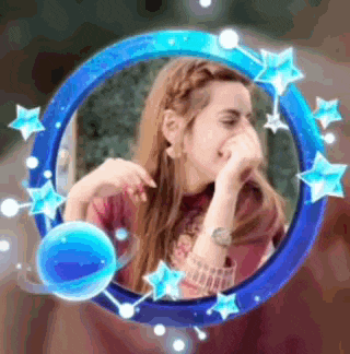 a woman is covering her mouth with her hand in a blue circle with stars around her .