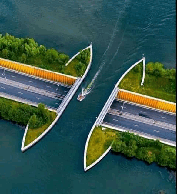 an aerial view of a bridge over a body of water .