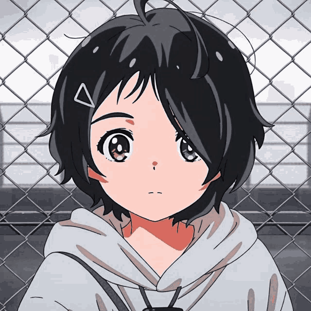 a girl with short black hair and a triangle in her hair