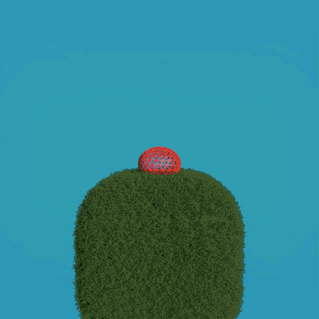 a red ball is flying in the air above a grassy hill