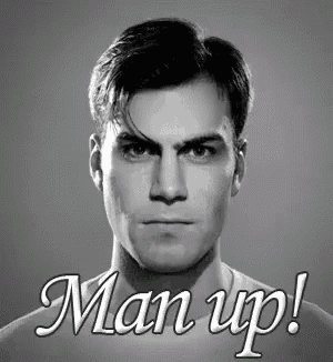 a man 's face is shown in a black and white photo with the words man up on the bottom