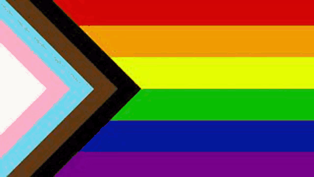 a rainbow flag with a black arrow pointing to the right .