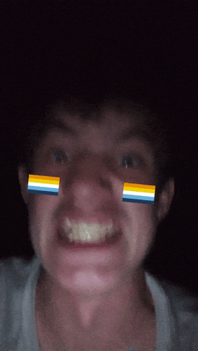 a close up of a man 's face with flags on his face