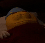 a stuffed smiley face is laying on a bed with its eyes closed and wearing a sleep cap .