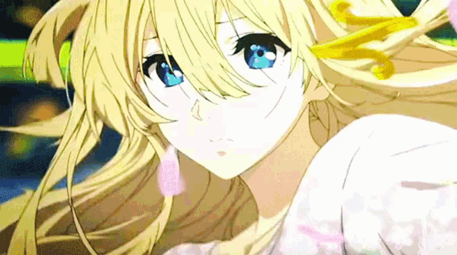 a blonde anime girl with blue eyes and long hair