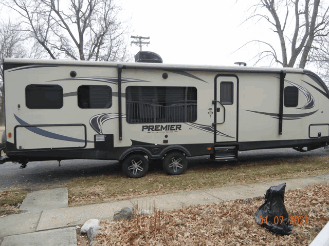 a white trailer with the word premier on the side of it