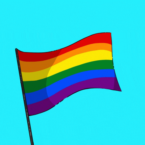 a rainbow flag waving in the wind on a blue background