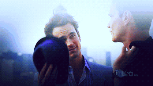 two men are standing next to each other and one of them is wearing a watch that says usc hd