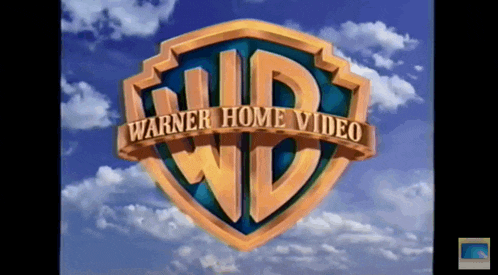 a logo for warner home video against a cloudy sky