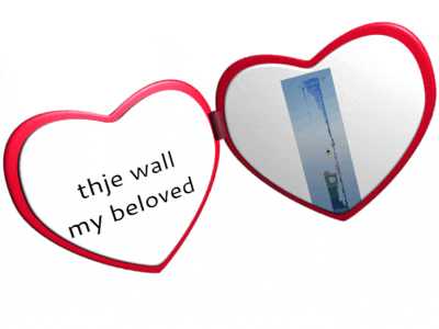 a heart shaped mirror with the words " the wall my beloved " on it