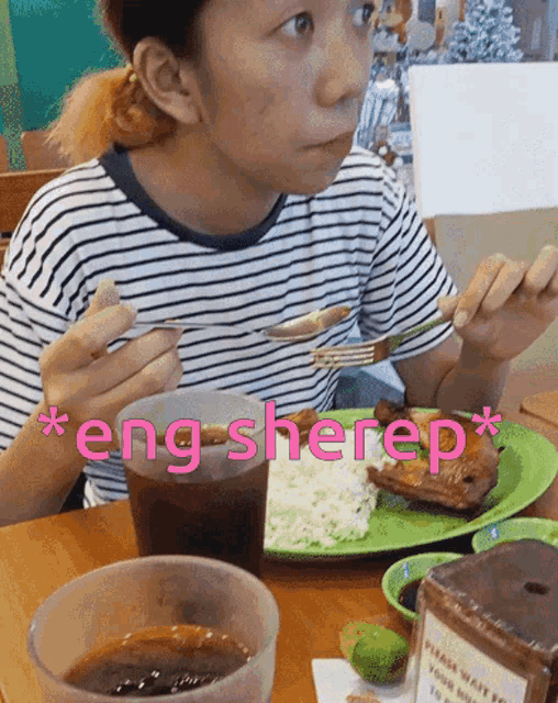 a woman is sitting at a table with a plate of food and a sign that says " please wait to be seated "