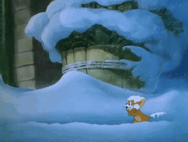 a cartoon mouse is standing in a snowy area