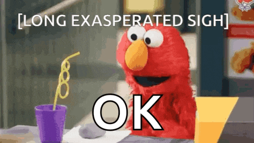 elmo from sesame street is sitting at a table with a straw in a cup .