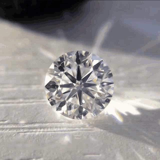 a close up of a diamond with a star shaped center