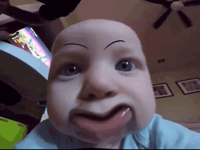 a baby with a fake eyebrow on his face