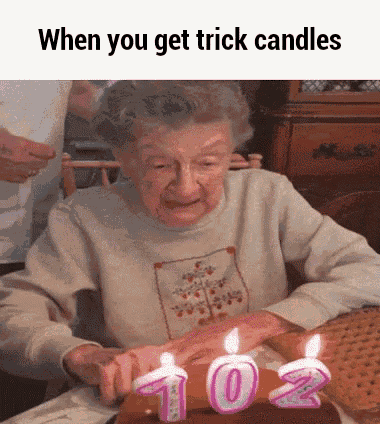 an elderly woman is blowing out candles on a cake with the words when you get trick candles below her