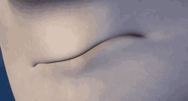 a close up of a person 's stomach with a curve in it .