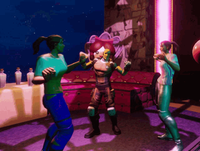 a man and two women are standing in a room with a purple light behind them