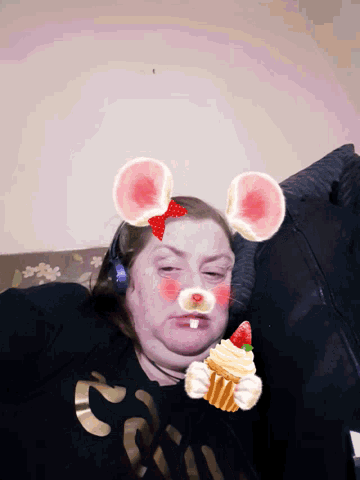 a woman wearing a black shirt with the number 2 on the front