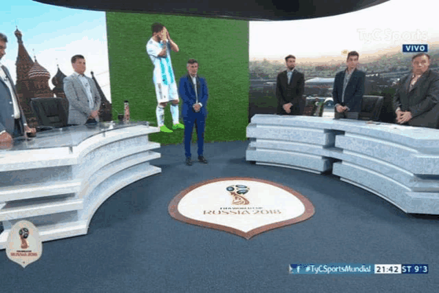 a group of men standing in front of a screen that says russia