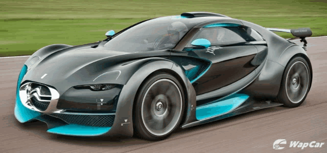 a gray and blue sports car is on a track with the word wapcar on the bottom