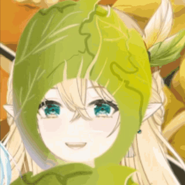 a close up of a girl wearing a green leaf hat and smiling .