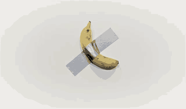 a banana is taped to a white wall