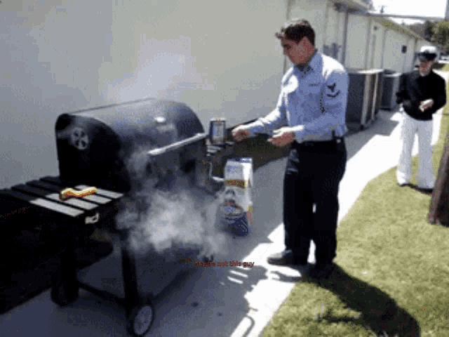 a man standing next to a grill with smoke coming out of it and the words smoke not a bug