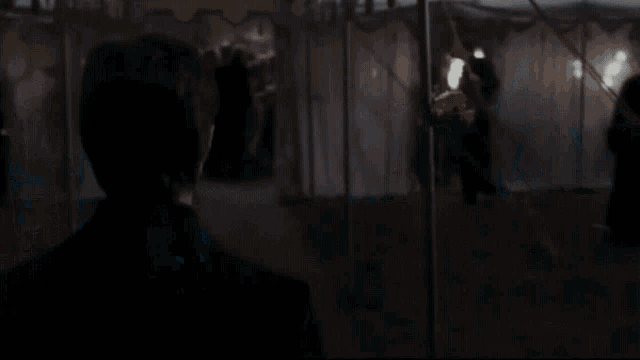 a man with a beard wearing a hat and a sweater