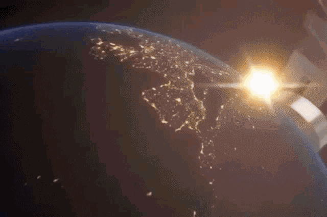 the sun shines brightly over the earth in space