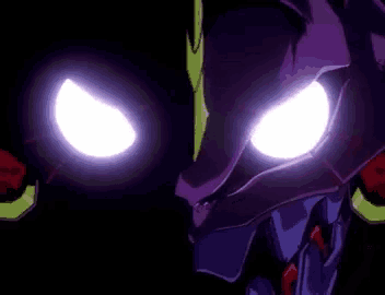 a close up of a robot 's eyes with purple and green lights .