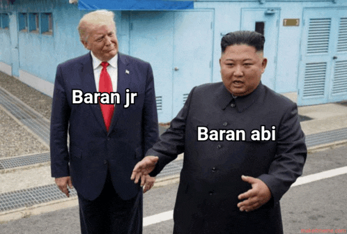 two men standing next to each other with baran jr and baran abi written on the front