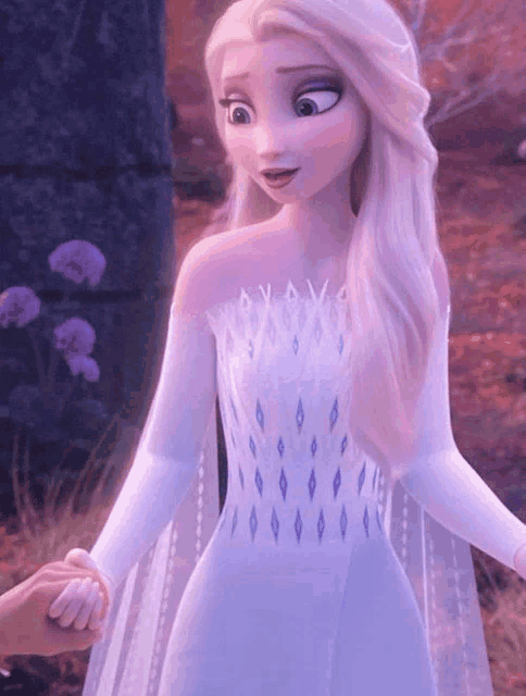 a close up of elsa from frozen 2 holding hands with someone