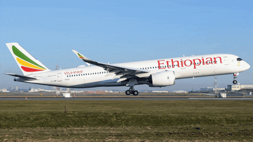 an ethiopian passenger jet is taking off from an airport runway