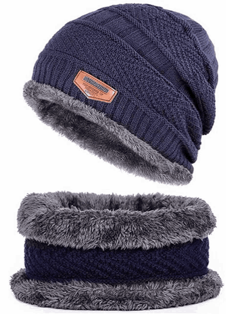 a blue knitted hat and scarf set with a furry lining .