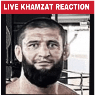 a picture of a man with a beard and the words live khamzat reaction above him