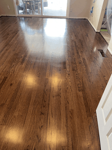 a wooden floor with a sliding glass door