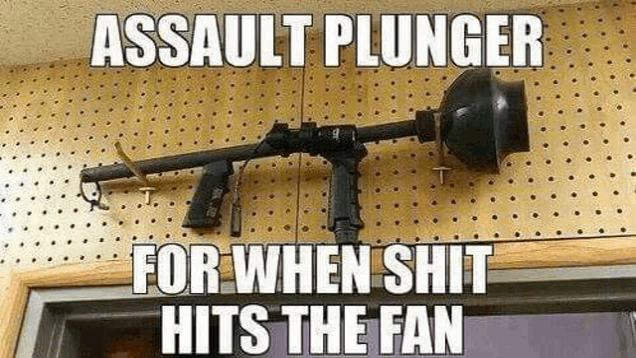 an assault plunger for when shit hits the fan is hanging on a wall next to a door .