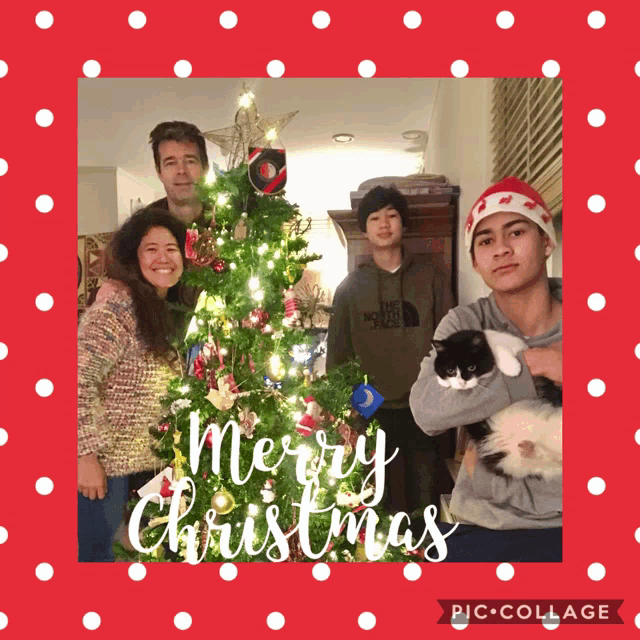 a family posing in front of a christmas tree with the words merry christmas on the bottom