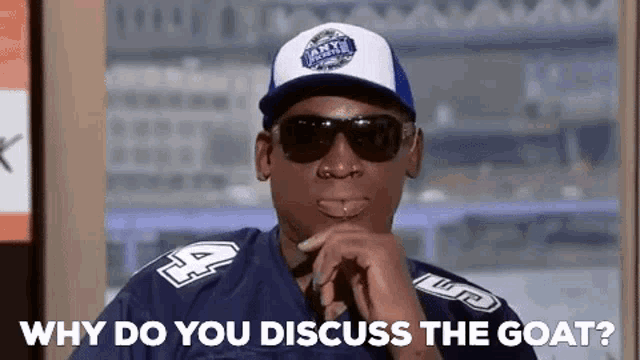 a man wearing a baseball cap and sunglasses is asking why do you discuss the goat .